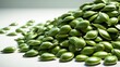 © Lasvu - Pile of green pumpkin seeds on white background