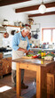 © CatNap Studio - Authentic cooking at home: Elderly man slicing vegetables with focus and care in brightly lit kitchen, preparing delicious family meal with love and dedication