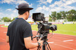 © funfunphoto - Man with high definition cinema camera on a movie set.