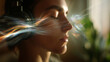 © dinatychynska - Peaceful woman practicing sound healing meditation with colorful light waves. Audio therapy concept showing mindful breathing and wellness through spiritual energy vibrations.