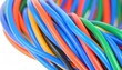 © xaras - Close-up of a vibrant bundle of multi-colored electrical wires representing network connectivity and data communication.