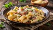 © Idea Lab - Mezzi Rigatoni alla Carbonara – half-sized rigatoni, creamy egg sauce, pancetta, parmesan, rustic Roman table
