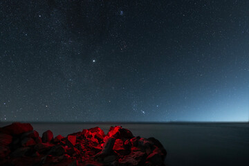 Wall Mural - Beautiful night landscape,  lake under starry sky.