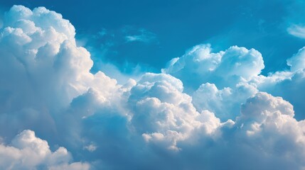 Wall Mural - Clouds forming majestic shapes in a brilliant blue sky on a bright sunny afternoon