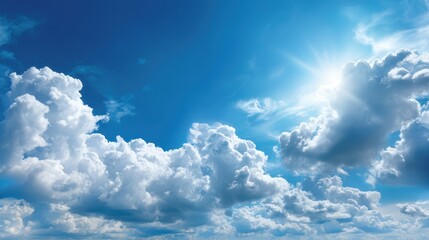 Wall Mural - Clouds forming majestic shapes in a brilliant blue sky on a bright sunny afternoon