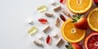 © Design Stock - Vibrant assortment of assorted vitamin capsules and fresh citrus fruits and strawberries on a clean white background for healthy living concept
