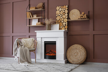 Poster - fireplace with armchair, shelves and decor near brown wall in living room