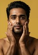 © Kamlesh - Closeup portrait of a handsome young indian man touching his face, promoting skincare and grooming