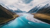 Aerial view of serene river winding through majestic mountains