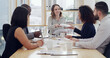 © Ru Booyens/peopleimages.com - Paperwork, business people or planning in meeting in office or financial insurance or strategy. Group, giving document or discussion with happy manager for risk management, policy feedback or report