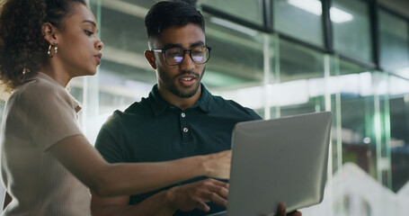 Laptop, meeting and web developers in office with troubleshooting online problem. Computer, conversation and IT professionals with technology for website crash, mistake or error in workplace.