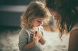 © abc123man - Child girl praying with emotion innocence faith hope spirituality focus concentration prayer pose vulnerability family comfort love devotion tender moment