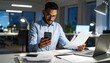 © 호균 최 - A person flipping through documents on a desk and checking their smartphone