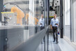 © BusinessClass by W61 - Businessman checking robots with digital tablet in high tech company