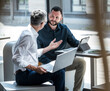 © BusinessClass by W61 - Manager and engineer having a business discussion in a modern office