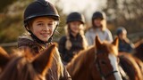 A group of young riders enjoying a sunny day at a riding school, smiling and bonding with their horses in a picturesque outdoor setting.