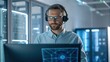 © Johnnii - A focused professional wearing a headset and glasses, working on a computer in a modern tech environment, surrounded by digital displays.