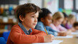 © Kateryna - Children focused on homework in colorful primary school classroom