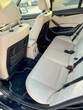 © Nataliia - Pristine car interior basks in sunlight, evoking road-tripping freedom, hygge journeys, and automotive feng shui tranquility