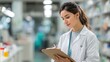 © Justlight - Pharmacist in lab coat highlighting oral antibiotic options on clipboard ward environment diffused in background for clarity.