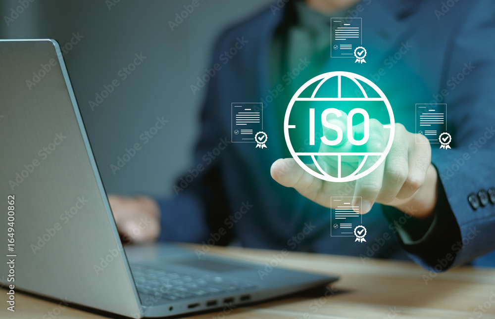 Businessman using digital interface for ISO certification and ...