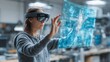 © Suriyo - Businesswoman controlling machine learning simulation via AR tablet