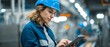 © Suriyo - Female quality inspector in helmet checking finished goods with tablet at the product inspection bench