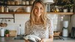 © Yevhen - Cheerful woman in home kitchen holding iron, getting ready to tackle laundry tasks