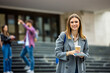© Mediteraneo - Female Student with Books and Coffee on College Campus