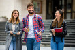 © Mediteraneo - Group of Students Laughing on College Campus
