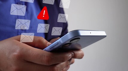 Message fraud prevention. Close-up of a mobile phone with a businesswoman holding an animation of several email icons with a warning sign.