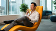 © True Stock - Asian Businessman Relaxing and Eating a Banana in Modern Office