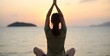 © Voziah - A young woman doing yoga by the sea at sunset, symbolizing harmony, meditation, and a healthy lifestyle. mindfulness concept.