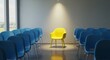 © facegolf - Illuminated Yellow Chair Among Blue Chairs - A single yellow chair stands out under a spotlight, surrounded by blue chairs.
