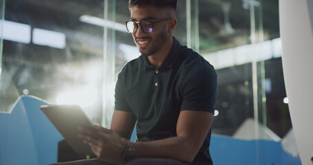 Happy, employee and man with tablet, office or testing application at night or software development. Working late, person and programming with tech on website, flare and debugging app in business