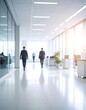 © Simpang - Modern office hallway, blurred figures