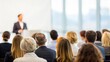 © N7 - Business audience in conference hall — engaging with keynote speaker