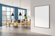 © ImageFlow - Modern office interior with large blank wall poster mockup and colorful workspace furniture in daylight city view setting. 3D Rendering