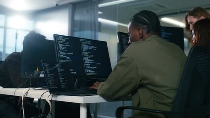 Professional Black Software developer and Computer Programmer Typing on keyboard and Using Desktop computer, writing code, Development Software Application, Cyber Security Programming in tech Office.