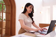 © snowing12 - Asian adult woman productive freelance work cafe using laptop computer for online business project management modern coworking space digital nomad lifestyle concept