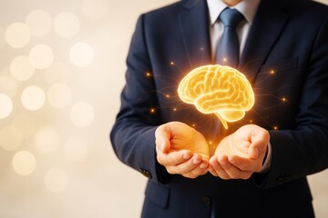 Wall Mural - businessman holding glowing 3d brain hologram in hands with light bokeh background, symbolizing inte