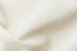 © reddish - Natural beige fabric textile with soft folds and texture close up