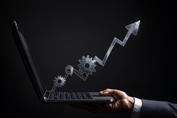 Businessman using a laptop with gears and arrows