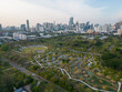 Aerial view modern city building with green tropical tree park