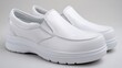 © MuhammadHajiji - Comfortable white slip-on shoes for work and everyday wear