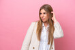 © luismolinero - Young caucasian woman isolated on pink bakcground having doubts