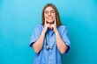 © luismolinero - Young surgeon doctor woman isolated on blue background smiling with a happy and pleasant expression