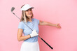 © luismolinero - Young golfer player woman isolated on pink background extending hands to the side for inviting to come