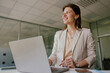 © Viktoria Kovalchuk - A Professional Businesswoman Engaged in her Work within a Contemporary Office Environment