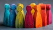 © Tanvir - Groups of colorful wooden figures on a gray backdrop. The concept of segmentation. Target audience, customer service. Market segment of buyers. Customer relationship management. .